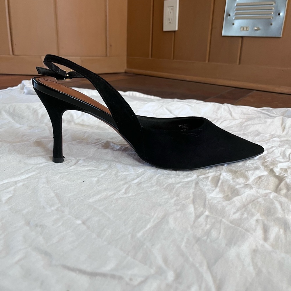 Black pointed toe sling backs